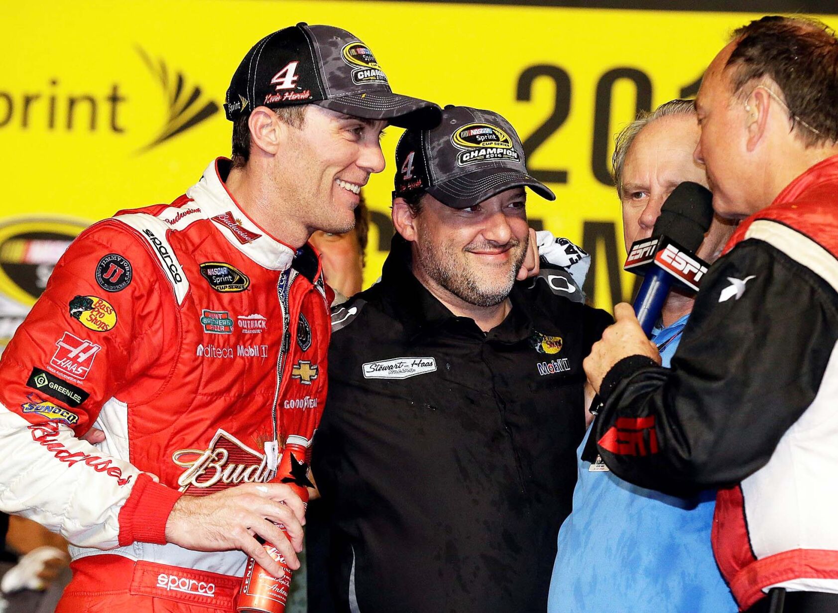(from left) Kevin Harvick with Tony Stewart and Gene Haas.